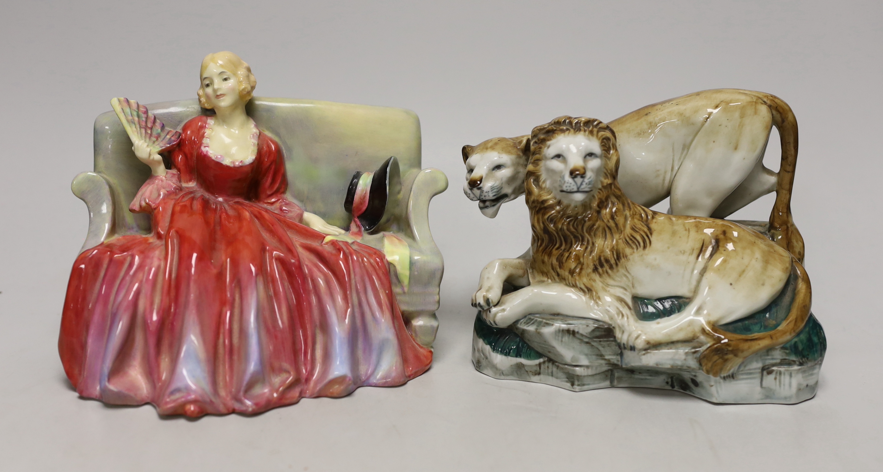 A Royal Doulton figure 'Sweet and Twenty' HN1298 and a continental porcelain lion and lioness group, marked 2964